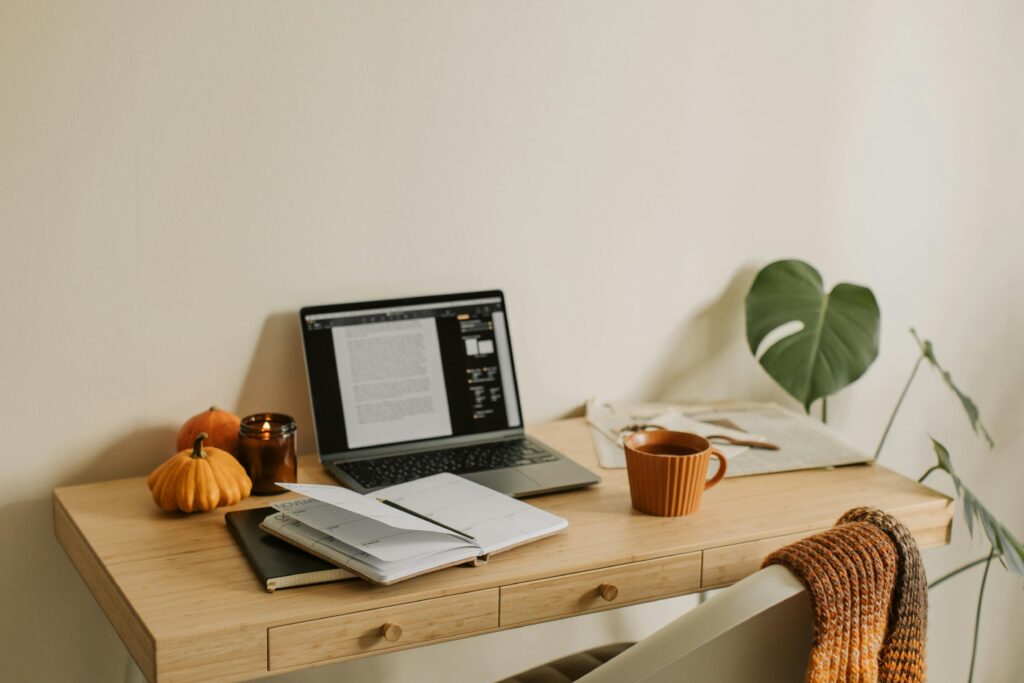 Elegant fall-inspired desktop with warm autumn tones, amber leaves, and golden accents styled for creative wedding inspiration.