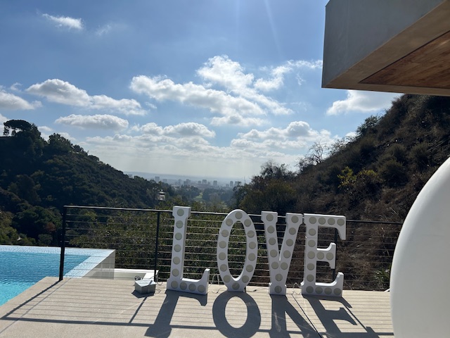 LOVE marquee overlooking the hills at a private Beverly Hills event venue.