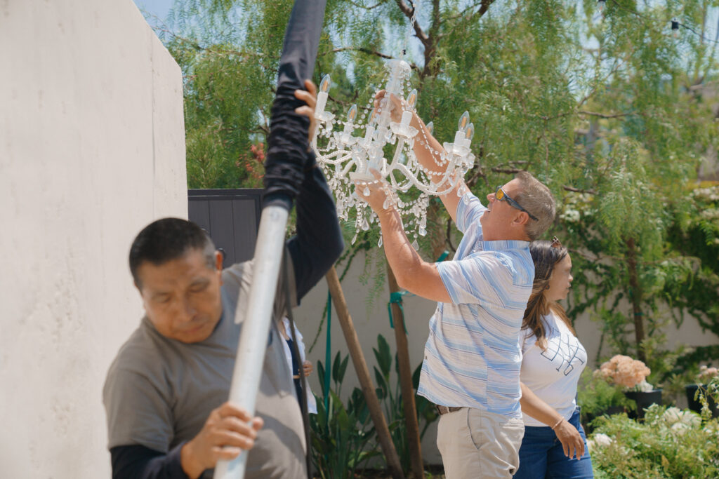 Wedding planner overseeing event setup and coordinating details during wedding preparation