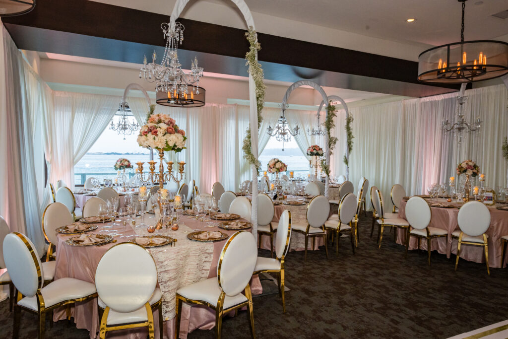 Elegant cohesive wedding reception design with layered lighting, florals, and thoughtful guest experience by Marshecka Weddings