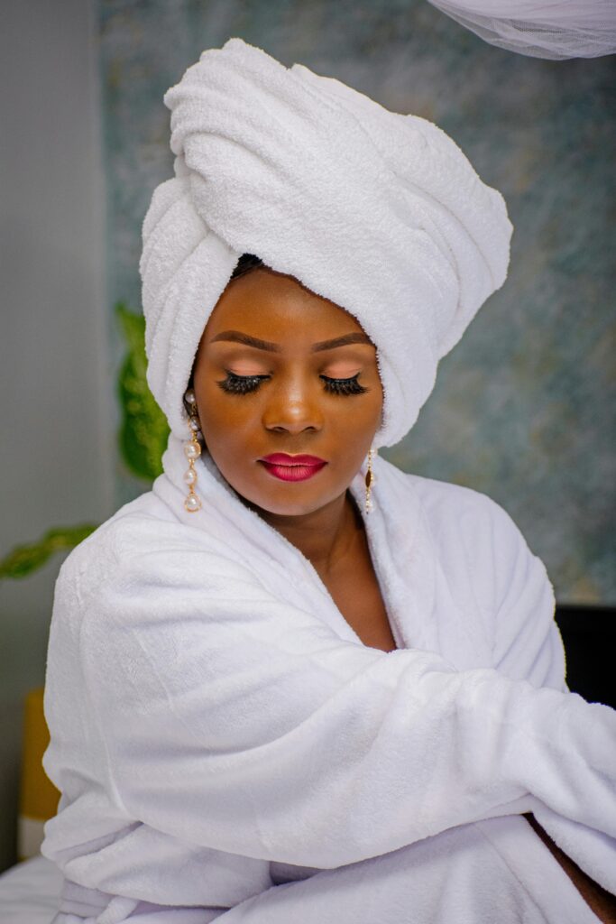 Bride taking a quiet moment of self-care and relaxation before her wedding day.